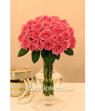 Two Dozen Pink Roses With a Vase