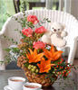 Orange Lilies With Carnations, And Other Flowers In A Basket With White Bear 