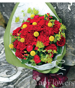 Red carnations, dragon fruit , cockscomb, roses