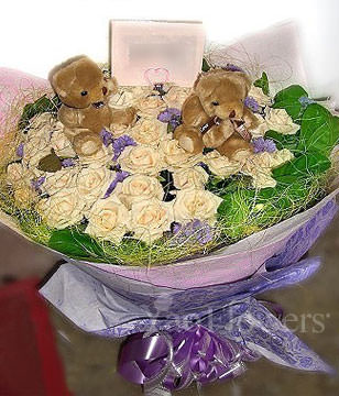 33 champagne roses ,lavenders ,two bears