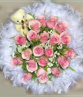15 pink roses ,prunus ssioris , goldenrods and a cute bear