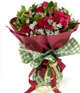 19 red roses, a small amount of peach carnations off Lacy and green leaves with