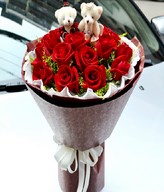 19 Red roses with a pair of bear
