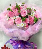 19 pink roses with some gardenia and aspidistra