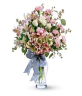 Vase arrangement of carnations, lilies and roses