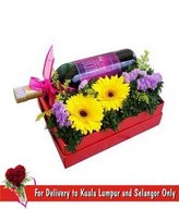 A bottle of Red Wine With Flowers Arrangement in a Special Red Box