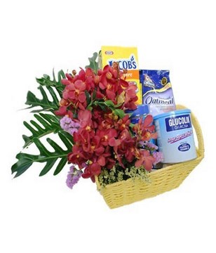 Flower arrangement with Oatmeal, Biscuit & others in a basket