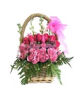 Arrangement of roses and carnation and fillers in a basket