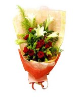 Hand bouquet of red rose and white lilies