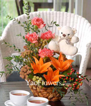 Orange Lilies With Carnations, And Other Flowers In A Basket With White Bear 