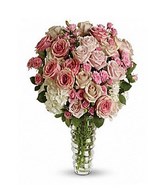 Bouquet of light pink roses, pink roses, creme roses, pink spray roses and variegated pittosporum