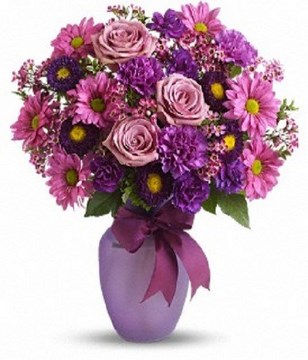 Lavender roses and daisy chrysanthemums, purple carnations, miniature carnations, asters and pink waxflower