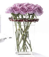 12 purple roses with a glass vase
