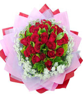 A bouquet of 22 red roses with green foliages
