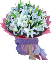 A bouquet of 11 white lilies with green foliages