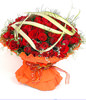 99 red roses with gladiolus and green foliages
