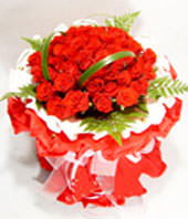 33 red roses with some gardenia and aspidistra wrapped by white inner and red outer circular paper