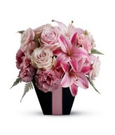Pink roses, pink carnations, and pink lilies arrangement