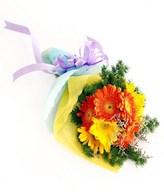 Orange and yellow gerberas with filler in a bouquet