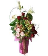 Arrangement of white lilies, red roses, pink roses, cymbidium orchids, and fillers