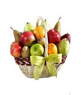 Apples, oranges, pears and grapes in a wicker basket