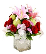 Flower Arrangement of Roses, Pink  Lily and filler in a clear glass vase