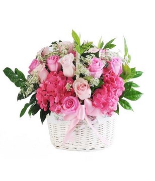 A basket of Assorted Pink Flowers & Baby's Breath