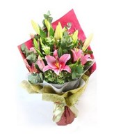 Arrangement of Pink Lily in hand bouquet