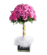 Topiary Flower of pink and purple roses in glass vase