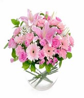 Arrangement of mixed flower in oval glass vase