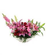 arrangement of red roses, pink lily, and pink snap dragon with filler in vase