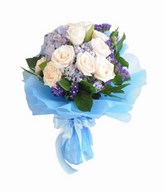 A bouquet of White Roses ), Blue Hydrangea, and fillers.