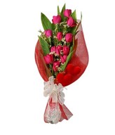 Bouquet of 12 Pink Roses in red netting 