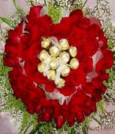 Basket Arrangement of 99 Red Roses with 12 Ferrero Rocher