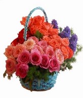Mixed color roses and fillers in basket