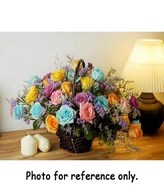Mixed color roses and caspia in a basket