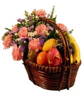 Carnations With A Basket Of Assorted Fruits