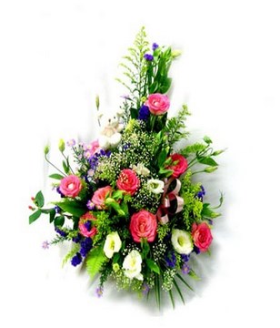 Basket of colorful pin roses, cream white eustomas, purple statices and baby breaths