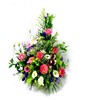 Basket of colorful pin roses, cream white eustomas, purple statices and baby breaths
