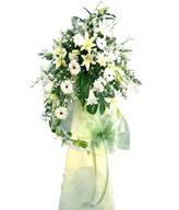 Arrangement of White Lilies and Daisies in Funeral Stand