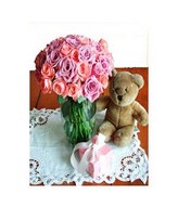 Mixed Roses in a bouquet with Teddy Bear