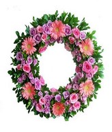 pink and lilac flowers in a circular wreath