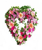 mixed roses, gerbera and daisies in a heart shaped wreath
